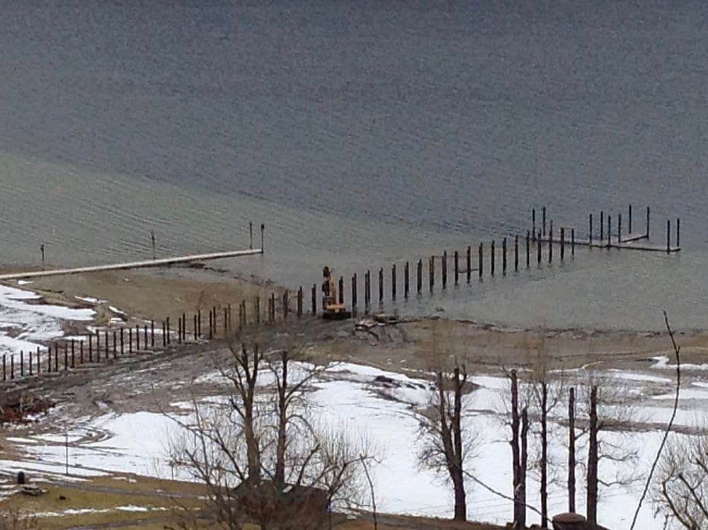 On-site view of pile driving rig at Chase Memorial Pier in Chase, BC, installing 12-inch steel pipe piles over aging timber supports as part of Burton Marine’s structural upgrade.