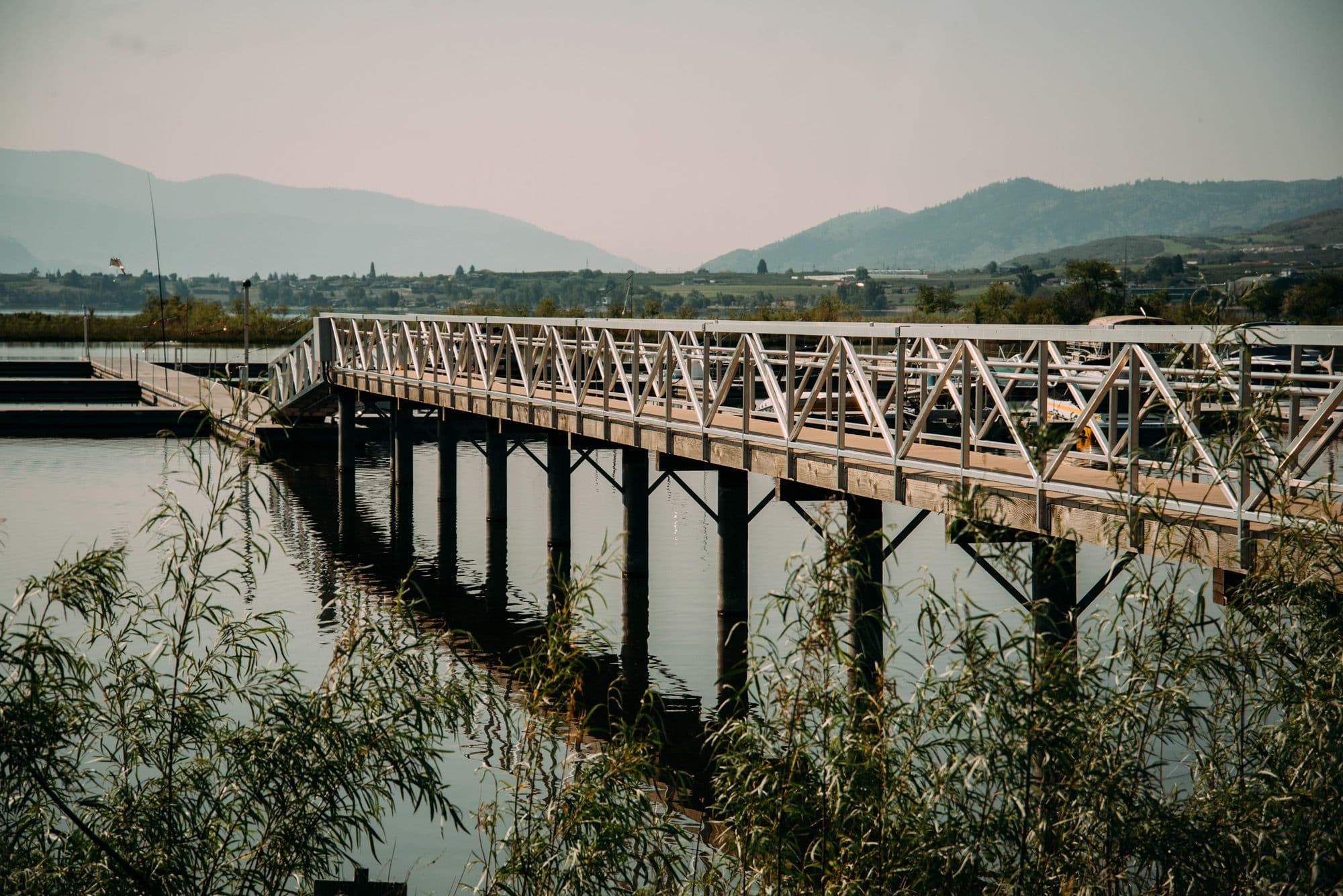 Side view of raised access gangway leading into Osoyoos Cottages Marina, built to accommodate fluctuating lake levels.