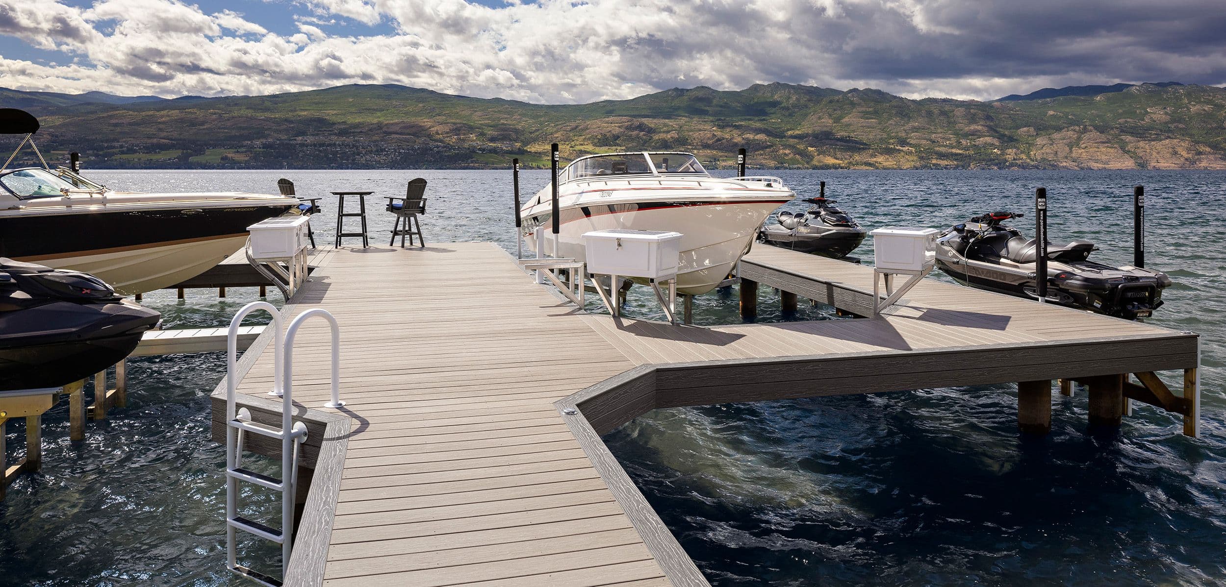 Fully customized composite dock system featuring boat slips, jet ski platforms, and seating — built for stability and premium lakefront living.