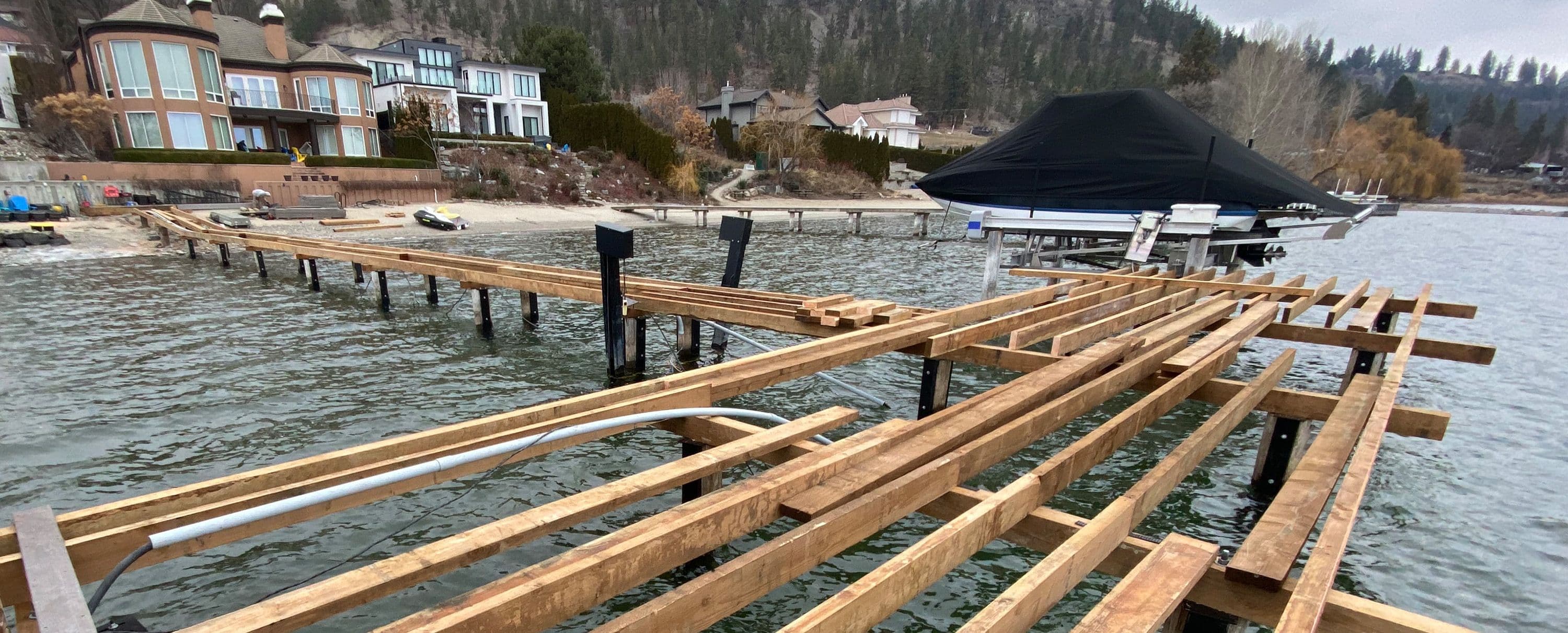 Dock under construction during a repair project, showcasing structural framing above the water.