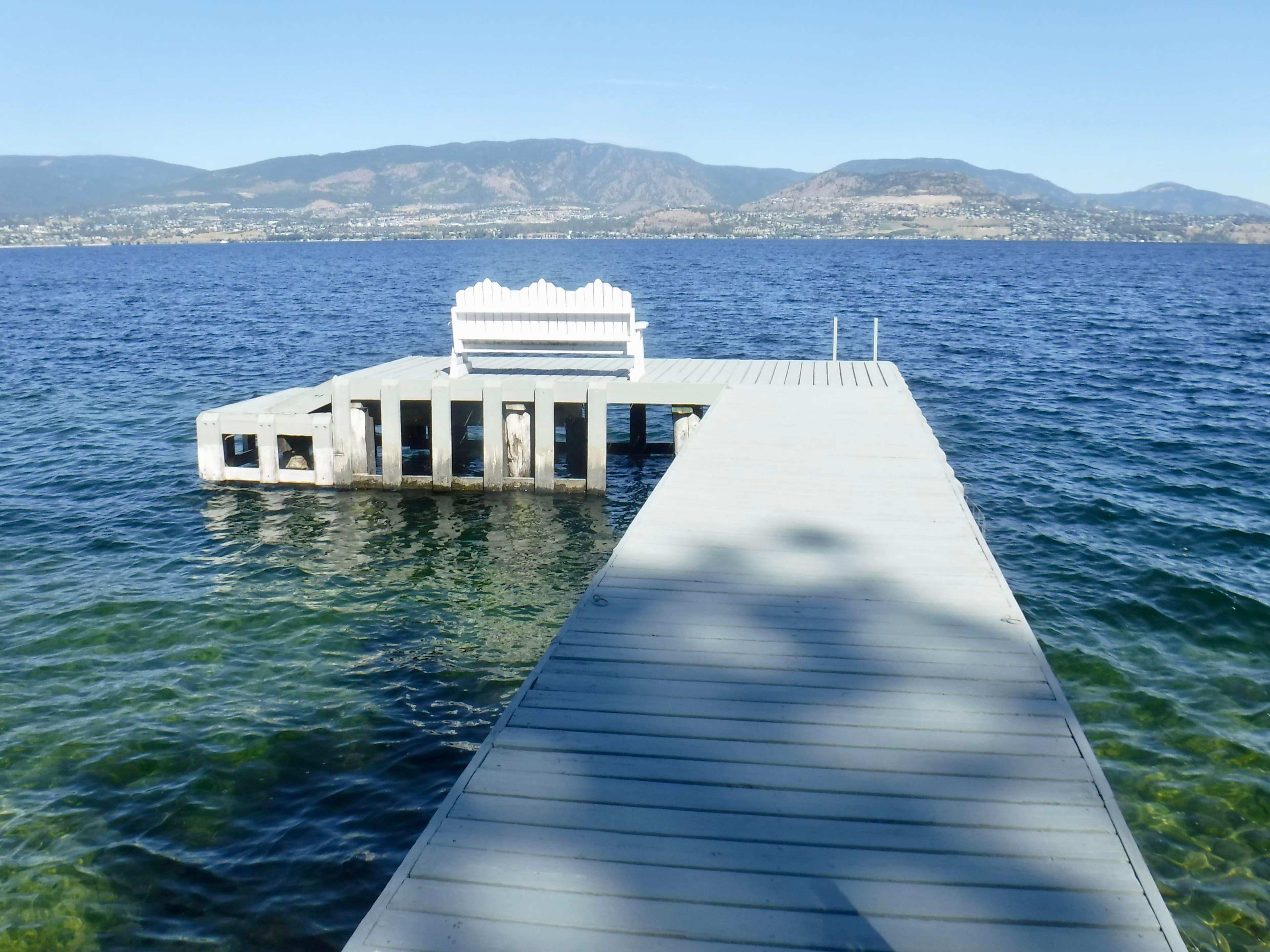 Worn wooden dock with aging frame and limited functionality on Okanagan Lake, photographed before full demolition and upgrade to a modern dock system.